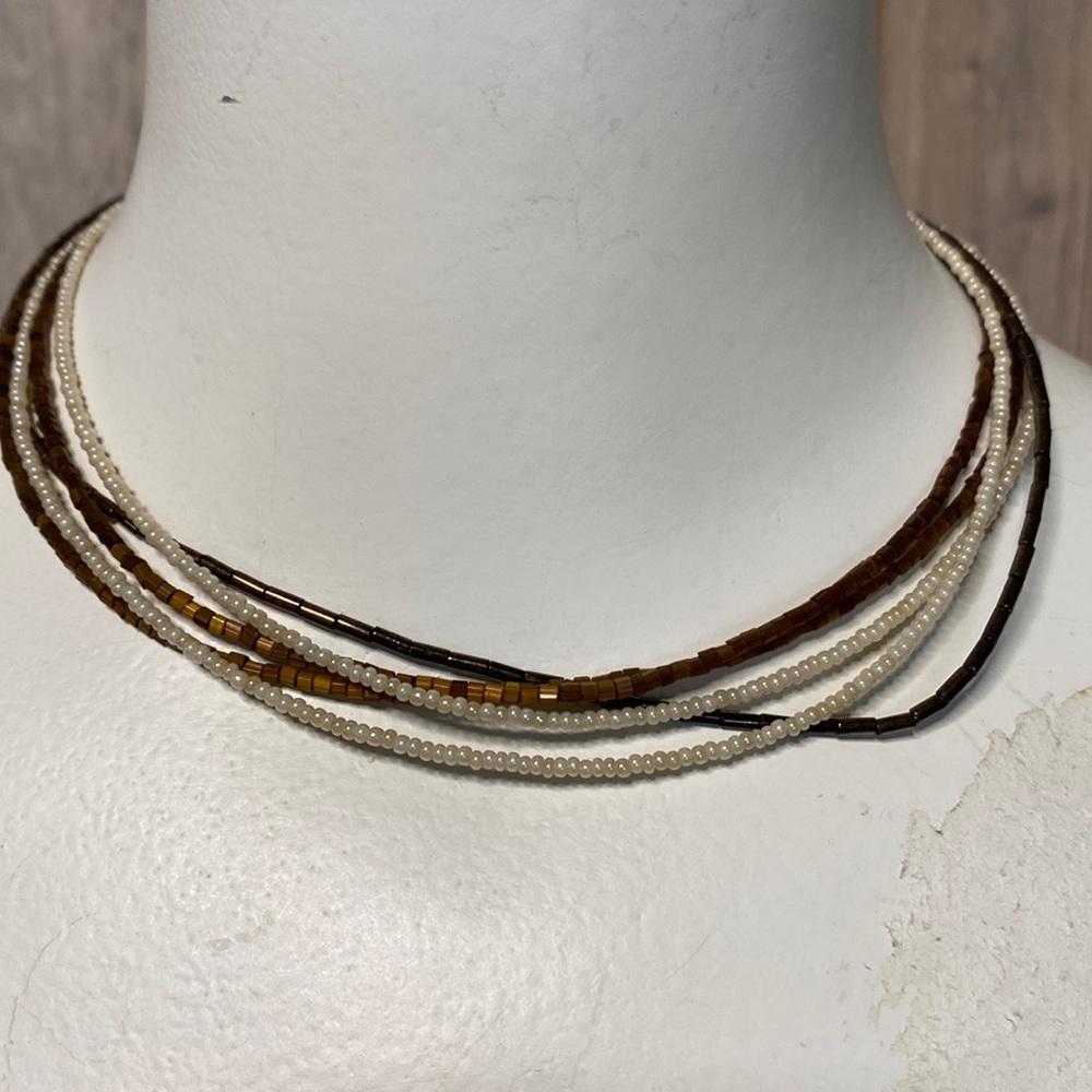 Multi strand 3 type brown beaded necklace, claw closure 2 lt. Brown, 1 dk Brown